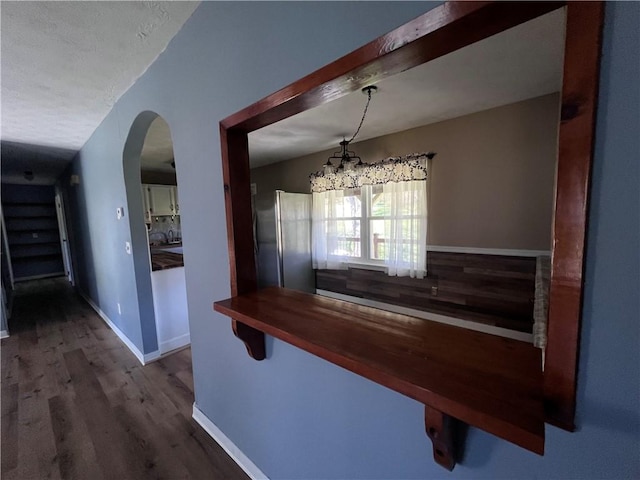 71 Redwing Ln, Horseheads, NY 14845 - interior space with arched walkways, baseboards, and wood finished floors