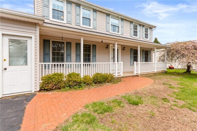 colonial-style house with covered porch