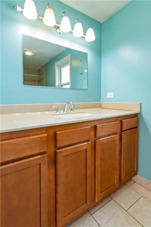 bathroom featuring tile patterned floors and vanity