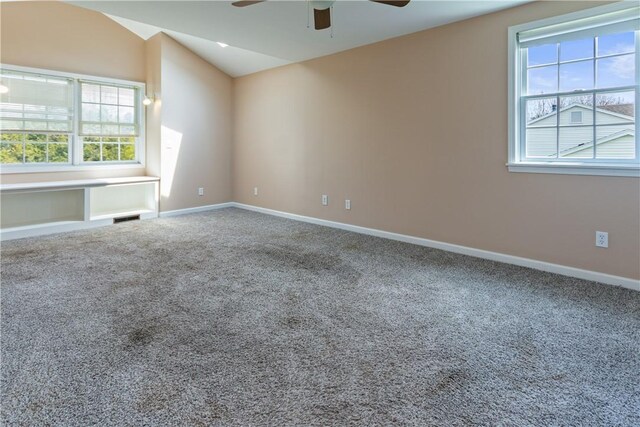 unfurnished room with carpet flooring, ceiling fan, visible vents, and baseboards