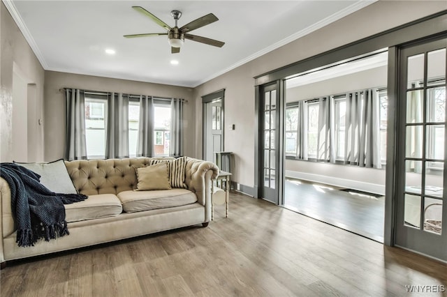 living room featuring recessed lighting, ceiling fan, a healthy amount of sunlight, and wood finished floors