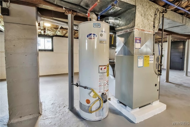 utility room with heating unit and water heater