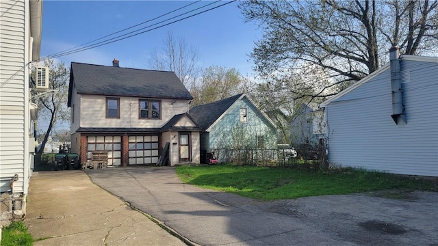 147 Roswell Ave, Tonawanda-Town, NY 14207 - exterior space with an attached garage, a front lawn, aphalt driveway, and fence