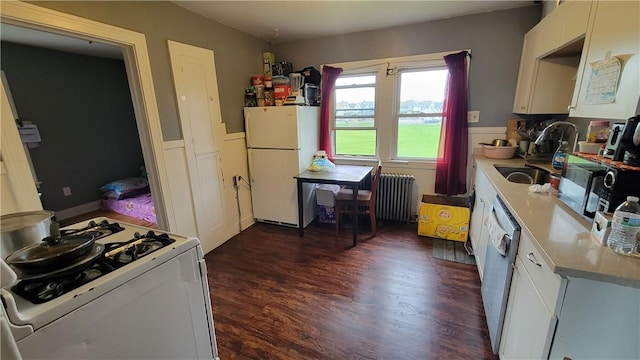 147 Roswell Ave, Tonawanda-Town, NY 14207 - kitchen featuring white cabinets, a sink, white appliances, dark wood finished floors, and radiator heating unit