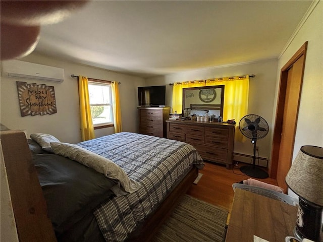1001 W Broad St, Horseheads, NY 14845 - bedroom featuring an AC wall unit, a baseboard heating unit, and wood finished floors