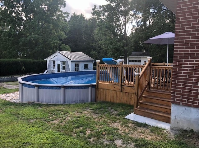 1001 W Broad St, Horseheads, NY 14845 - pool with a lawn, a wooden deck, and an outbuilding
