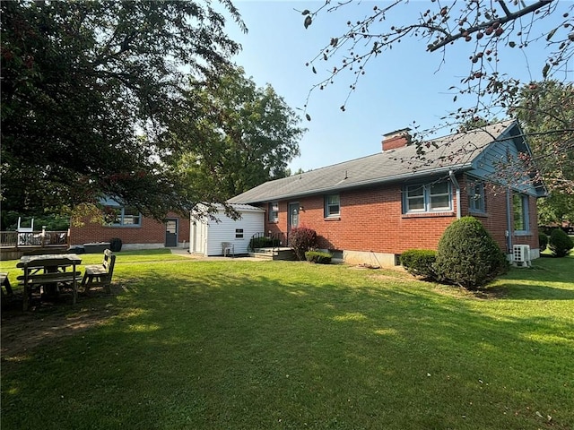 1001 W Broad St, Horseheads, NY 14845 - rear view of property featuring a yard, brick siding, and a chimney