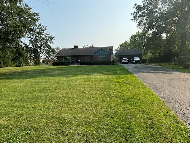 1001 W Broad St, Horseheads, NY 14845 - view of front of home featuring driveway, a chimney, and a front yard
