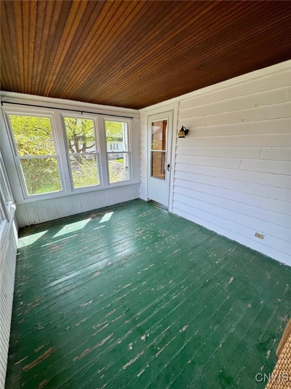 unfurnished sunroom featuring a wealth of natural light
