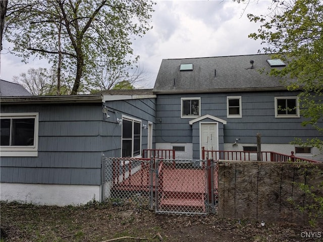 134 Malden Rd, Salina, NY 13211 - back of house with fence, a gate, and roof with shingles