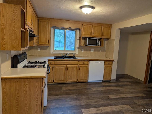 134 Malden Rd, Salina, NY 13211 - kitchen featuring a sink, dishwasher, stainless steel microwave, decorative backsplash, and range with gas cooktop