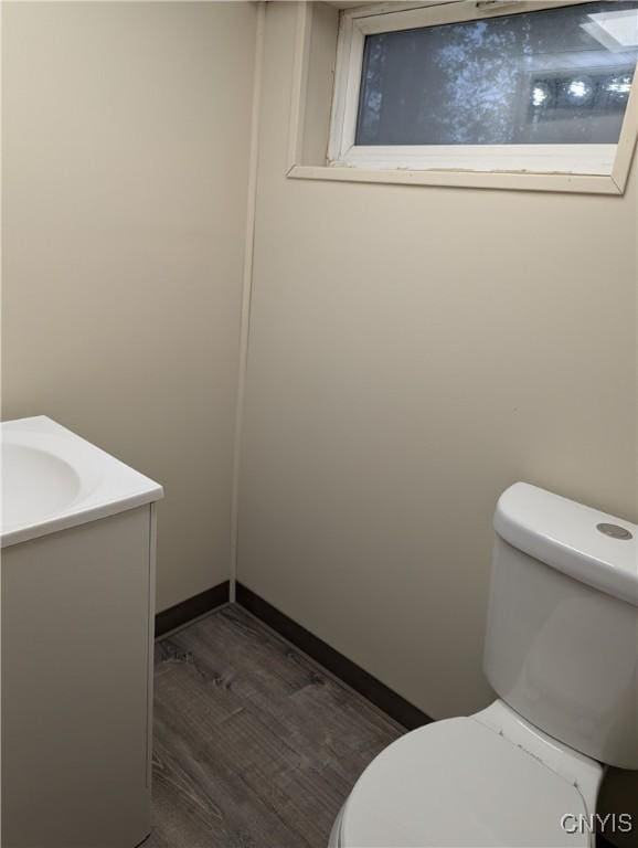 134 Malden Rd, Salina, NY 13211 - bathroom featuring toilet, wood finished floors, and vanity