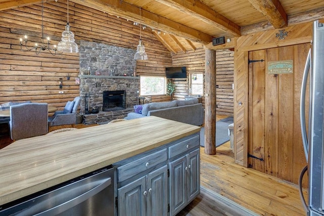 851 Lower Meeker Hollow Rd, Roxbury, NY 12474 - kitchen with a fireplace, hardwood / wood-style floors, wooden counters, wood ceiling, and stainless steel appliances