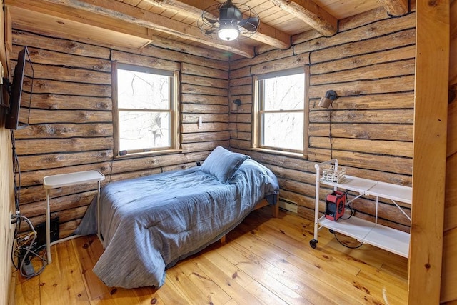 851 Lower Meeker Hollow Rd, Roxbury, NY 12474 - bedroom featuring beam ceiling, wooden ceiling, log walls, and hardwood / wood-style flooring