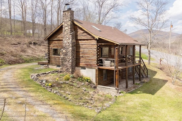 851 Lower Meeker Hollow Rd, Roxbury, NY 12474 - view of side of home featuring a deck, a yard, a chimney, and log siding