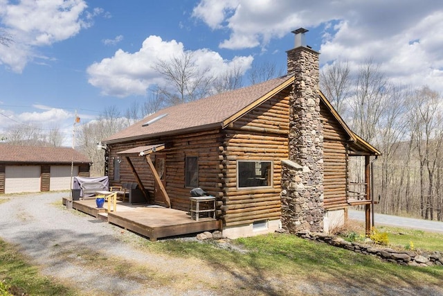 851 Lower Meeker Hollow Rd, Roxbury, NY 12474 - view of side of property with an outdoor structure, a deck, a chimney, log exterior, and a detached garage