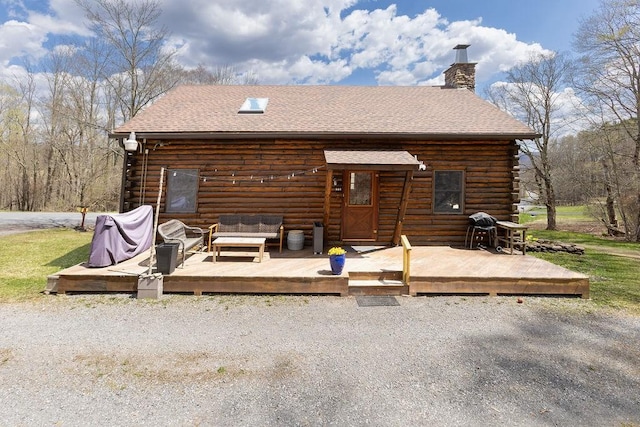 851 Lower Meeker Hollow Rd, Roxbury, NY 12474 - rear view of house with a chimney, roof with shingles, log siding, a wooden deck, and an outdoor hangout area