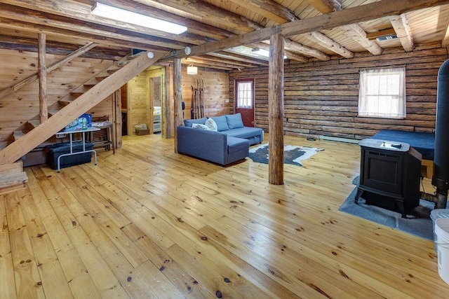 851 Lower Meeker Hollow Rd, Roxbury, NY 12474 - interior space with stairs, wood-type flooring, a wealth of natural light, and a wood stove