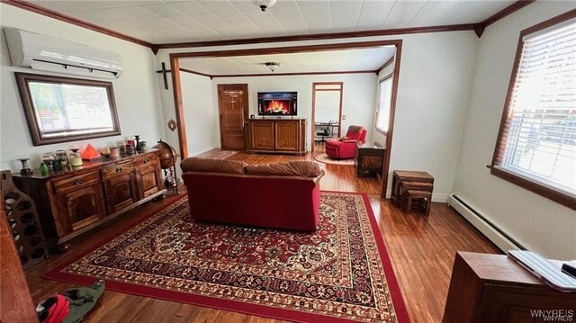 3319 Riverside Dr, Scio, NY 14895 - living area featuring wood finished floors, ornamental molding, a baseboard radiator, and a wall mounted AC