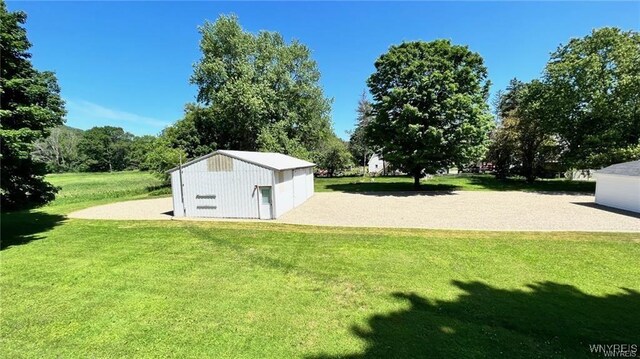 3319 Riverside Dr, Scio, NY 14895 - view of yard with a detached garage and an outbuilding