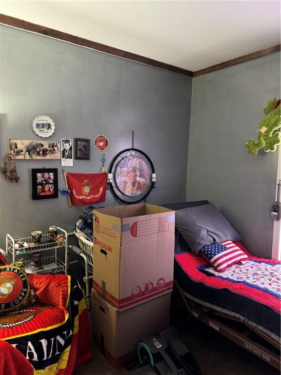 bedroom featuring crown molding