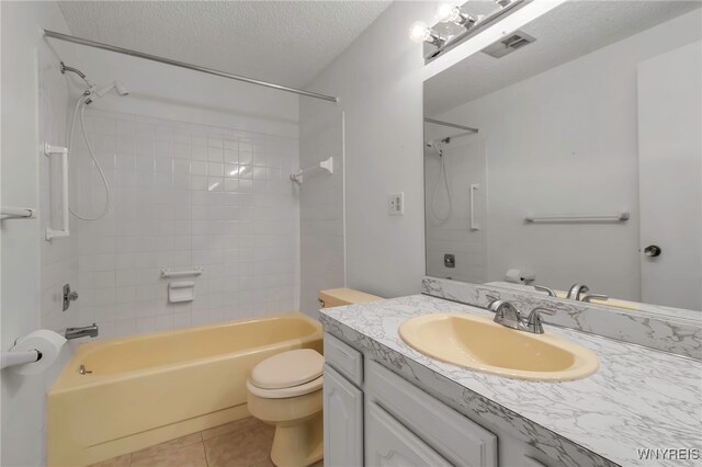 bathroom featuring bathtub / shower combination, toilet, a textured ceiling, and visible vents