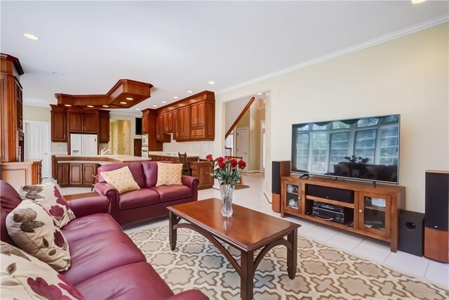 living area featuring crown molding, light tile patterned floors, and recessed lighting