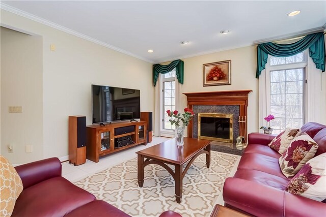 tiled living area with crown molding, recessed lighting, and a fireplace
