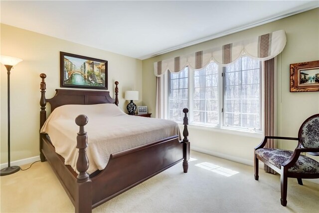 carpeted bedroom with baseboards