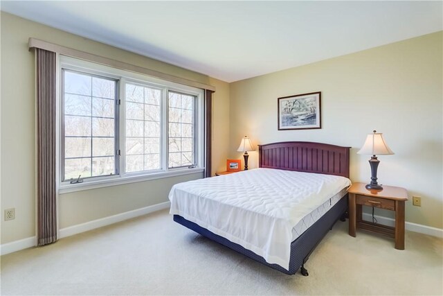 bedroom with carpet flooring and baseboards