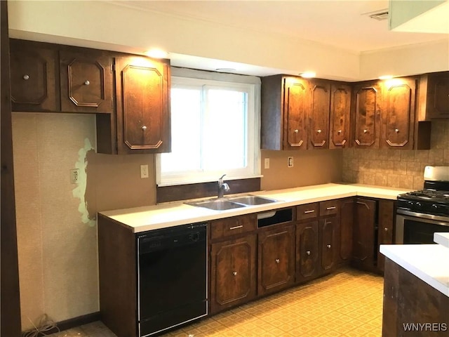 kitchen with stainless steel gas stove, light floors, light countertops, a sink, and dishwasher