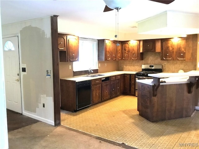 kitchen with a sink, stainless steel range with gas stovetop, black dishwasher, and a healthy amount of sunlight
