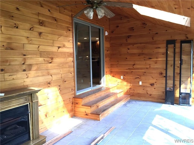 view of patio / terrace featuring a ceiling fan and entry steps