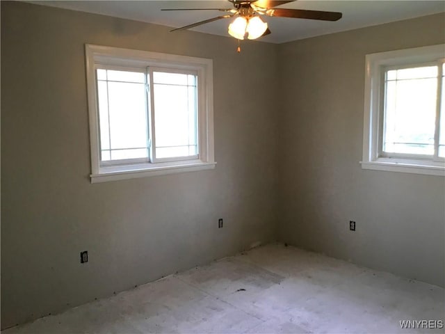 unfurnished room with a ceiling fan