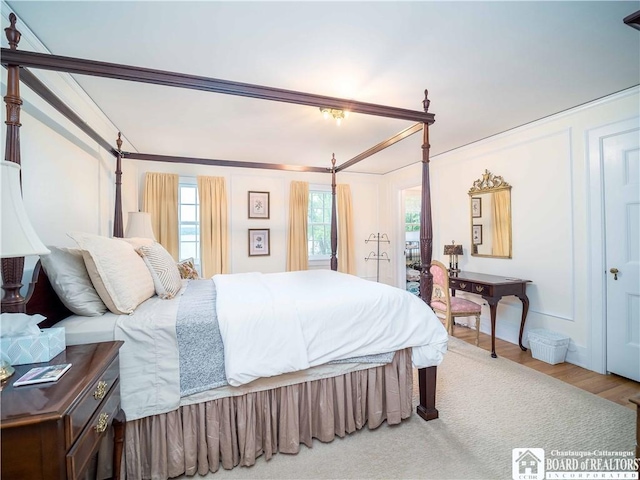 bedroom with wood finished floors