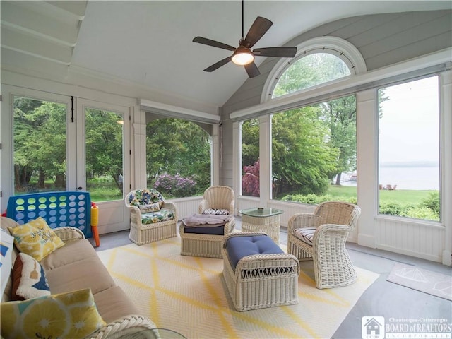 sunroom featuring a ceiling fan and outdoor lounge area