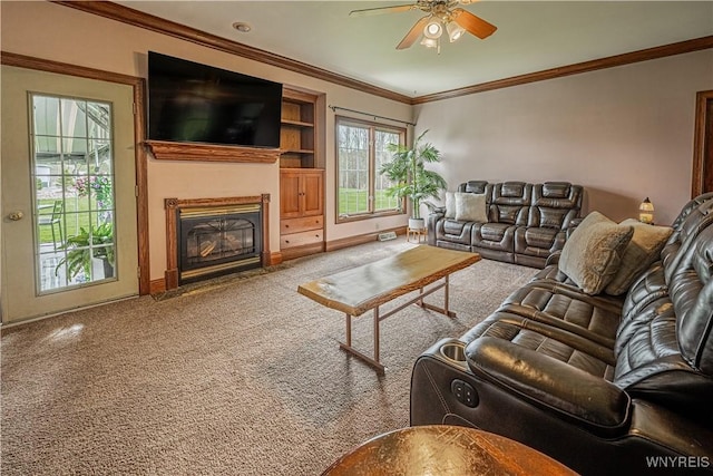 2575 Fuller Rd, Newfane, NY 14028 - living area with crown molding, a ceiling fan, a fireplace with flush hearth, baseboards, and carpet flooring