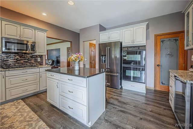 2575 Fuller Rd, Newfane, NY 14028 - kitchen with decorative backsplash, dark wood-style flooring, light stone counters, black appliances, and wine cooler
