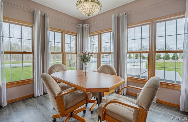 2575 Fuller Rd, Newfane, NY 14028 - dining space featuring baseboards, light wood finished floors, and a healthy amount of sunlight