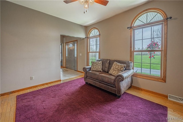 2575 Fuller Rd, Newfane, NY 14028 - living room featuring baseboards, ceiling fan, wood finished floors, and visible vents