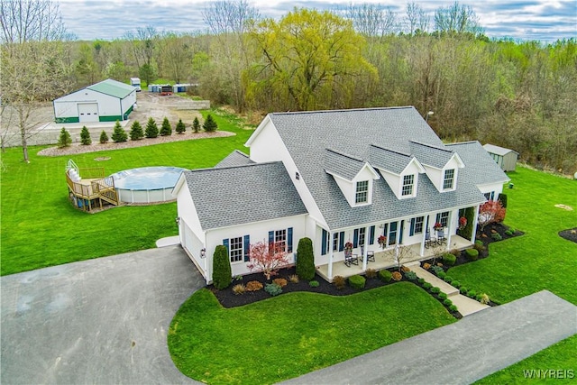 2575 Fuller Rd, Newfane, NY 14028 - aerial view featuring a forest view