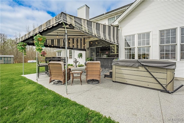 2575 Fuller Rd, Newfane, NY 14028 - back of house with a patio, a hot tub, and a yard