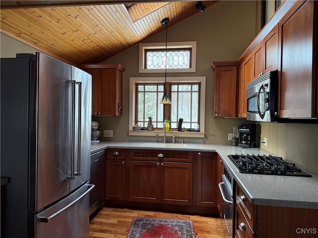 2321 Olanco Rd, Spafford, NY 13110 - kitchen featuring appliances with stainless steel finishes, a sink, wooden ceiling, a skylight, and light wood finished floors