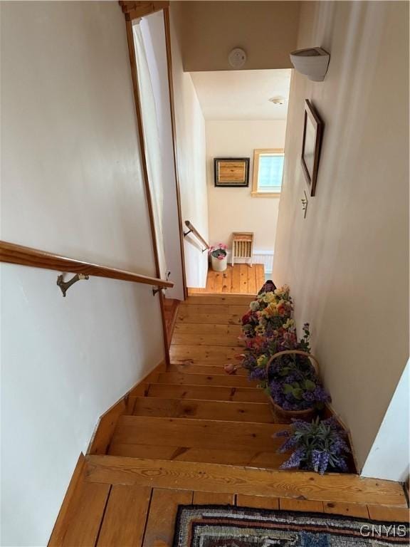 2321 Olanco Rd, Spafford, NY 13110 - stairway featuring wood-type flooring
