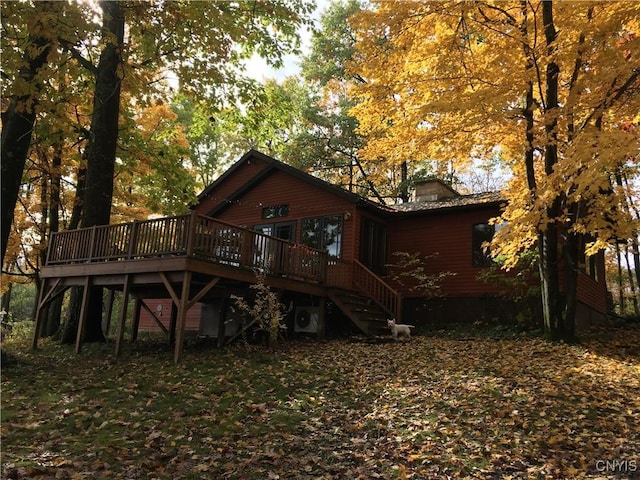 2321 Olanco Rd, Spafford, NY 13110 - back of house with a deck, a chimney, and stairway
