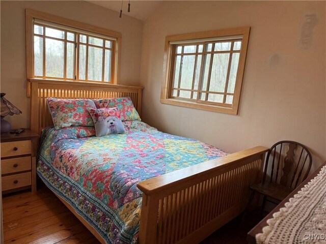 2321 Olanco Rd, Spafford, NY 13110 - bedroom featuring wood-type flooring and lofted ceiling