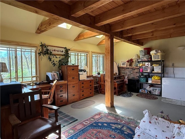 2321 Olanco Rd, Spafford, NY 13110 - bedroom featuring beam ceiling, concrete flooring, a skylight, a wood stove, and wooden ceiling