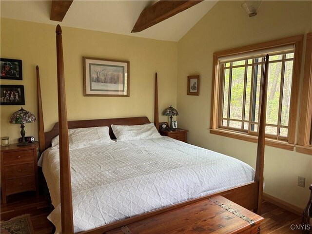 2321 Olanco Rd, Spafford, NY 13110 - bedroom with wood finished floors, vaulted ceiling, and baseboards