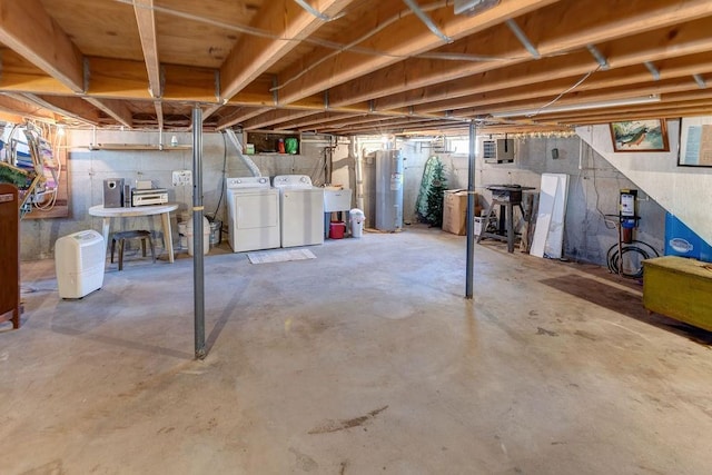 unfinished below grade area with a sink, washer and clothes dryer, and water heater