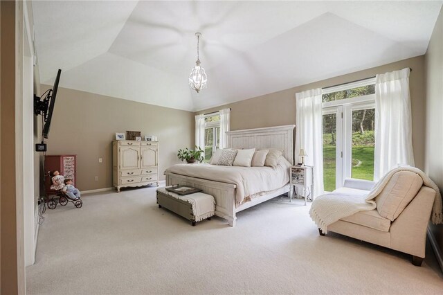 bedroom featuring carpet flooring and vaulted ceiling